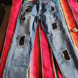 Joseph Ribkoff distressed/patched jeans embellished with rhinestones